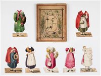 Lot 579 - Manuscript paper doll book.