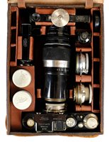 Lot 374 - Leica II rangefinder (1932) with 35mm, 50mm and 135mm lenses.