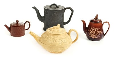 Lot 91 - Teapots. An early 19th century black basalt teapot, probably Spode