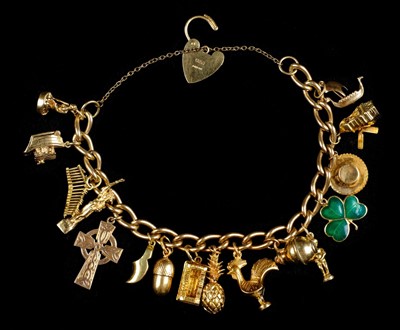 Lot 2 - Bracelet. A 9ct gold hollow link charm bracelet