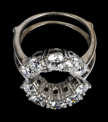 Lot 23 - Ring. An 18ct white gold jacket ring set with 10 brilliant cut diamonds