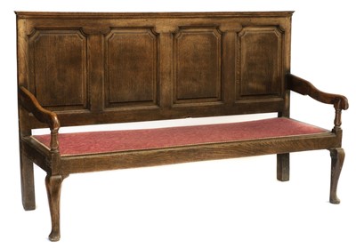 Lot 140 - Settle. An early 19th century oak settle