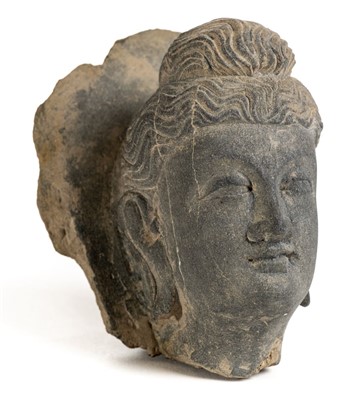 Lot 122 - Gandhara Carving. A large carved schist stone head of Bodhisattva