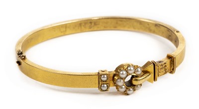 Lot 1 - Bangle. A Victorian yellow metal and pearl bangle