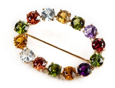 Lot 6 - Brooch. A Continental 18ct gold multigem set brooch