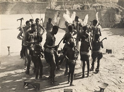 Lot 125 - French West Africa. A pair of photographs of young men waiting to be circumcised, circa 1920s