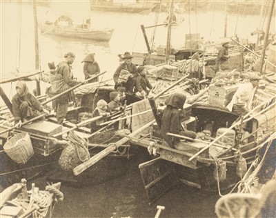 Lot 165 - Hong Kong. A group of small boats with families along the waterfront, circa 1930s