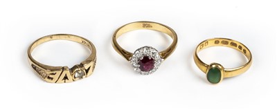 Lot 25 - Rings. A 22ct gold ring set with a green stone cabochon and 2 others
