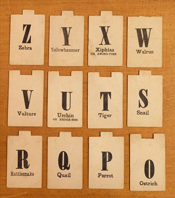 Lot 536 - Alphabet. A set of pictorial alphabet tiles, c. 1830s