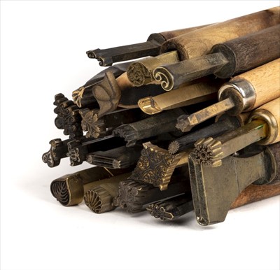 Lot 409 - Decorative finishing tools. 21 brass decorative finishing tools