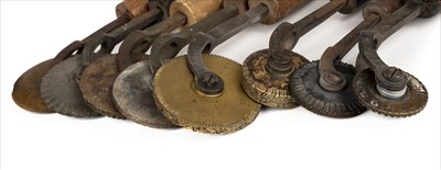 Lot 411 - Decorative rolls. A collection of 7 decorative rolls & 1 fillet wheel