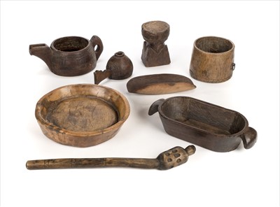 Lot 112 - Tribal Art. A mixed collection of African carved wood vessels