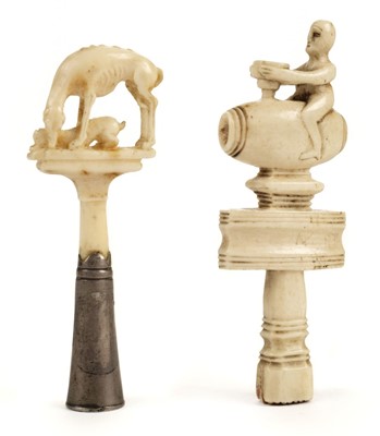 Lot 143 - Pipe tampers. Two 18th century ivory pipe tampers