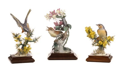 Lot 322 - Royal Worcester. A pair of models of a Redstart and Gorse and one other