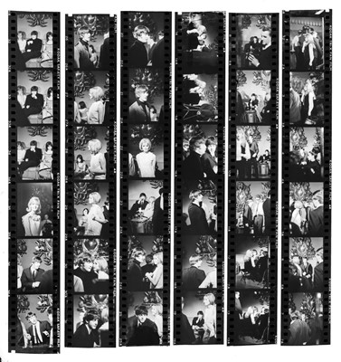 Lot 93 - The Beatles: A Hard Day's Night. The Beatles seated and standing in the Garrison Room