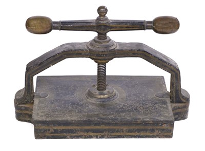 Lot 520 - Book press. A cast iron book press