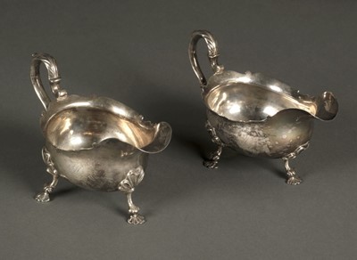 Lot 46 - Sauce Boats. A matching pair of George III silver sauce boats by George Hunter