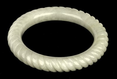 Lot 86 - Bangle. A Chinese pale green hardstone slave bangle