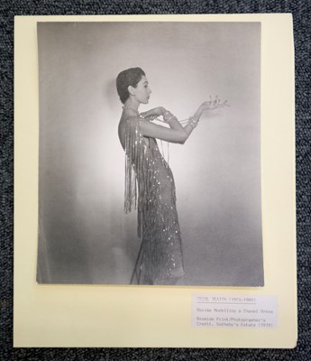 Lot 6 - Beaton (Cecil, 1904-1980). Dovima wearing Chanel, February 1953
