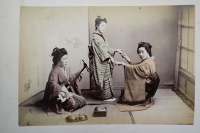 Lot 64 - Japan. A concertina album of 50 colour tinted albumen prints