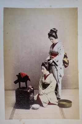 Lot 64 - Japan. A concertina album of 50 colour tinted albumen prints