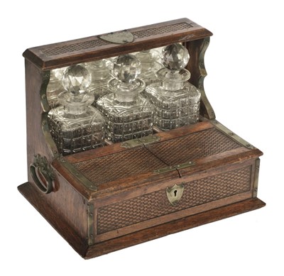 Lot 74 - Tantalus. Victorian three bottle tantalus