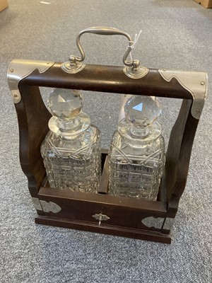 Lot 73 - Tantalus. A mid 20th century two bottle tantalus