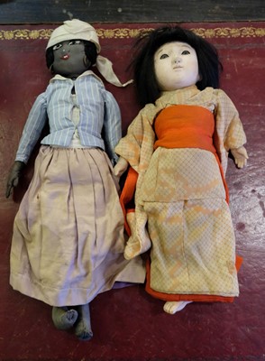Lot 515 - Dolls. A slave doll, late 19th century, & others