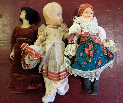Lot 515 - Dolls. A slave doll, late 19th century, & others