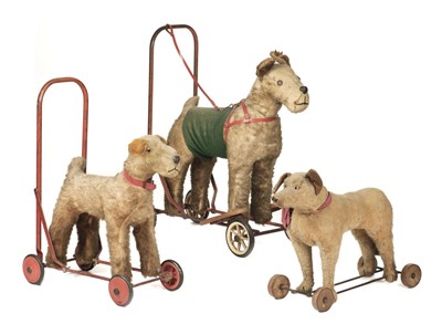 Lot 519 - Toy animals on wheels. Pedigree Soft Toys push along terrier dog, late 1950s-early 1960s, & others