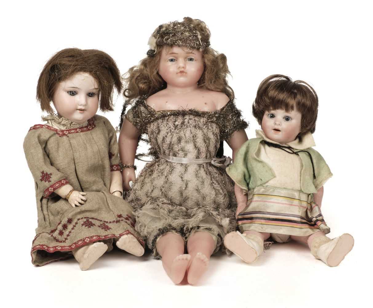 Lot 514 - Dolls. A bisque head doll, French, early 20th century, & other dolls and jigsaws