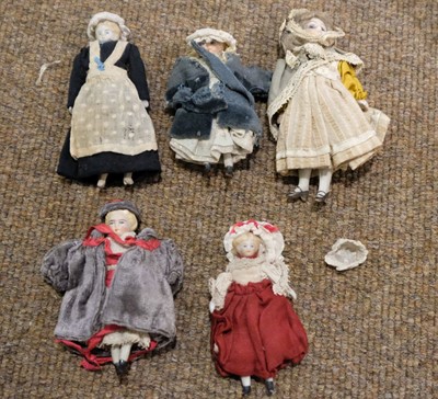 Lot 514 - Dolls. A bisque head doll, French, early 20th century, & other dolls and jigsaws