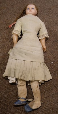 Lot 514 - Dolls. A bisque head doll, French, early 20th century, & other dolls and jigsaws