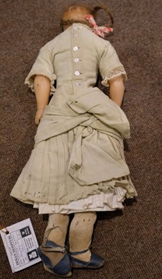 Lot 514 - Dolls. A bisque head doll, French, early 20th century, & other dolls and jigsaws
