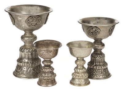Lot 495 - Tibet. Early 20th century Tibetan butter lamps