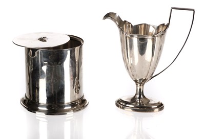 Lot 411 - Cream Jug. An Edwardian silver cream jug and tea canister 

Silver cream jug & lidded container