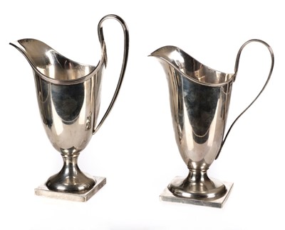 Lot 412 - Cream Jugs. A Victorian silver cream jug by George Unite and one other