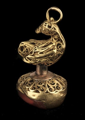 Lot 376 - Fob. An Interesting 19th-century yellow metal fob/pendant with carved carnelian classical head