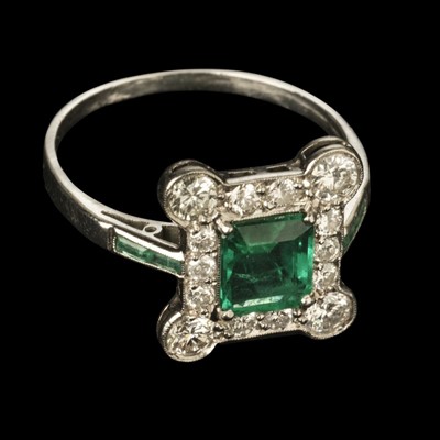 Lot 372 - Emerald and Diamond Ring. An art deco emerald and diamond cluster ring
