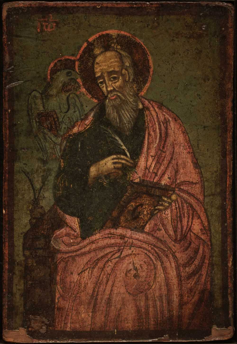 Lot 117 - Icon. A Greek icon of Saint John the Apostle holding a quill and volume, probably early/mid 19th c.
