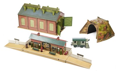 Lot 253 - Model Rail. A collection of Hornby Series O Gauge model rail tinplate buildings etc