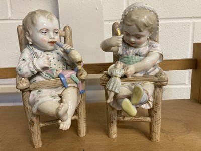 Lot 76 - Porcelain Infants. A pair of Edwardian porcelain figures