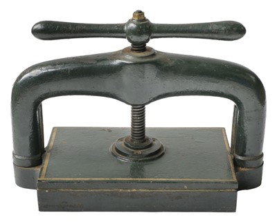 Lot 473 - Book press. A cast iron book press