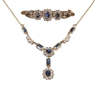Lot 11 - Corundum Jewellery. A yellow and white metal corundum necklace and brooch
