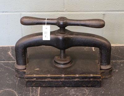 Lot 64 - Book press. A cast iron book press