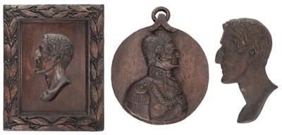 Lot 565 - Duke Of Wellington. Three carved oak Duke of Wellington profiles