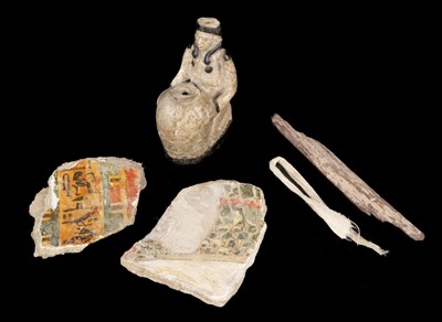 Lot 468 - Ancient Egypt. An old tobacco box containing pieces of an ancient Egyptian mummy case