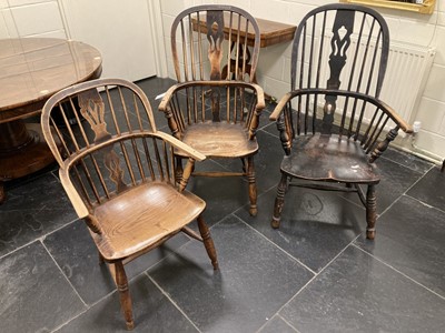Lot 619 - Windsor Chairs. Three 19th century elm Windsor chairs