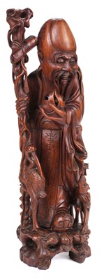 Lot 327 - Chinese Figure. A carved hardwood figure of Shou Lao (the god of longevity)