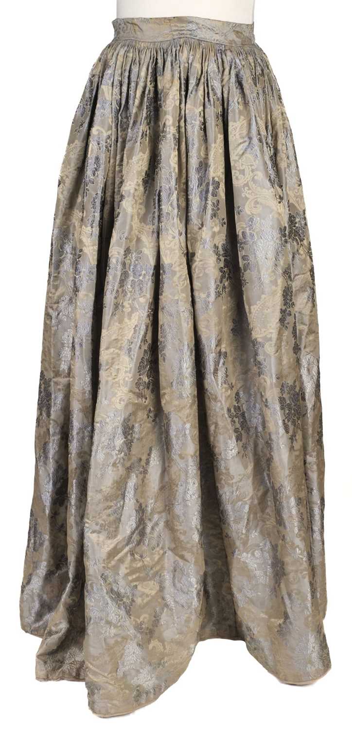 Lot 718 - Clothing.  A blue brocade skirt, circa 1850s, & other skirts, shoes, and waistcoats